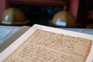 Handwritten script on an aged piece of paper with the title The Rights of Women